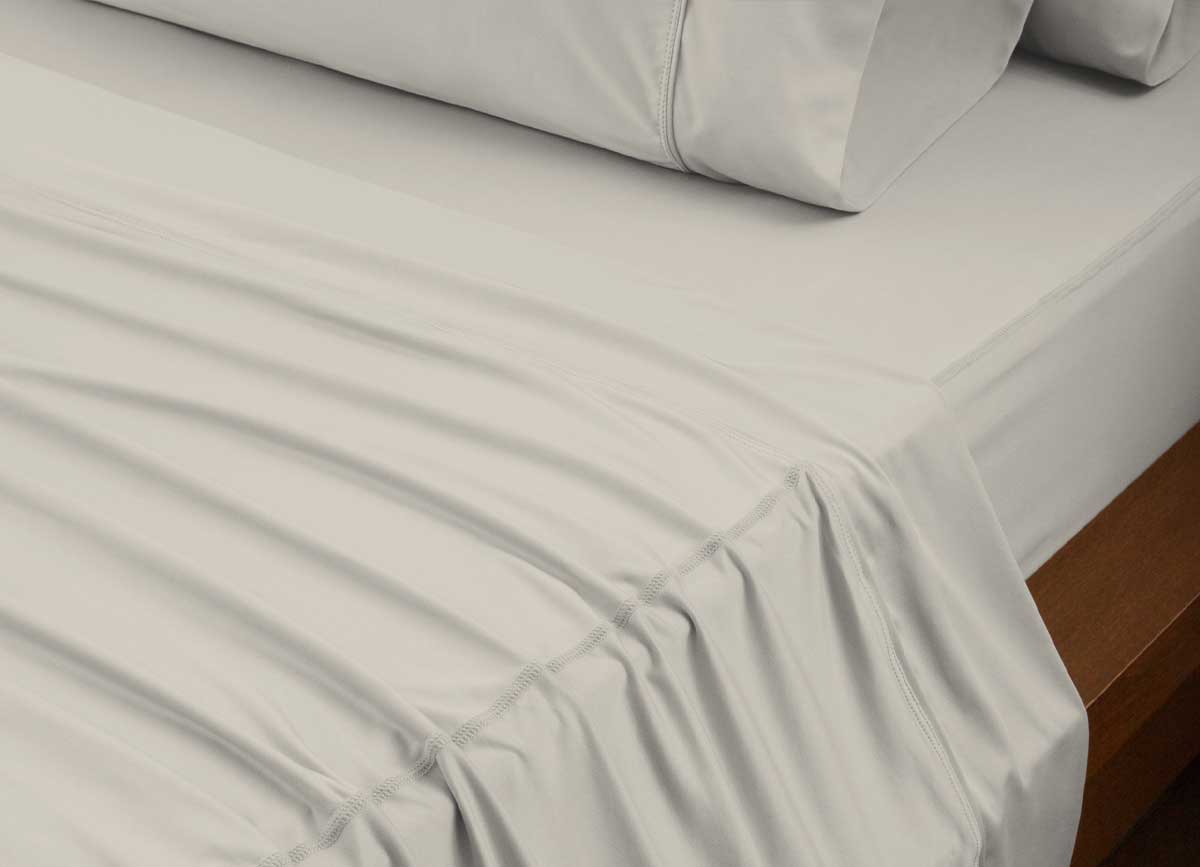 reNEWed Sheet Set on bed in room environment, Khaki #choose-your-color_khaki
