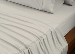 reNEWed Sheet Set on bed in room environment, Khaki #choose-your-color_khaki