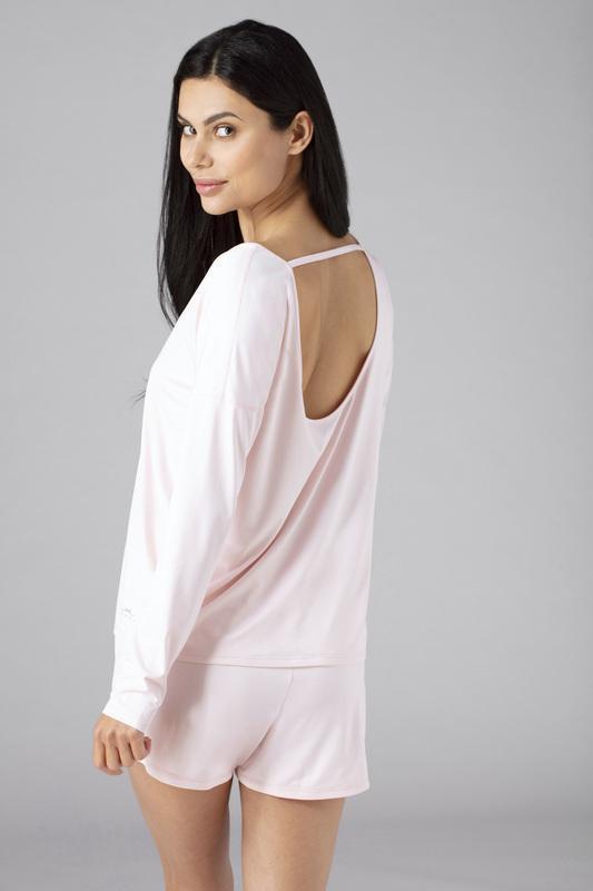 Model wearing the SHEEX Women's Open Back LS Tee in Blush Pink #choose-your-color_blush-pink