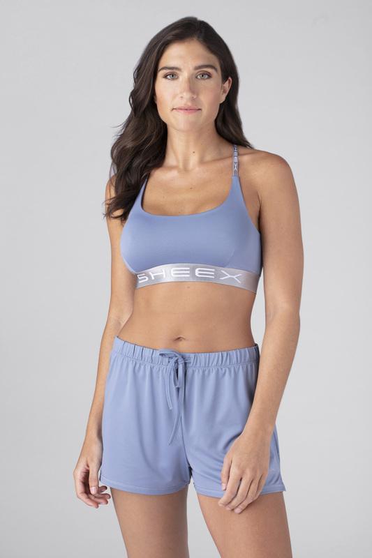 Model wearing the SHEEX Women's Bra Top in Light Blue  #choose-your-color_light-blue