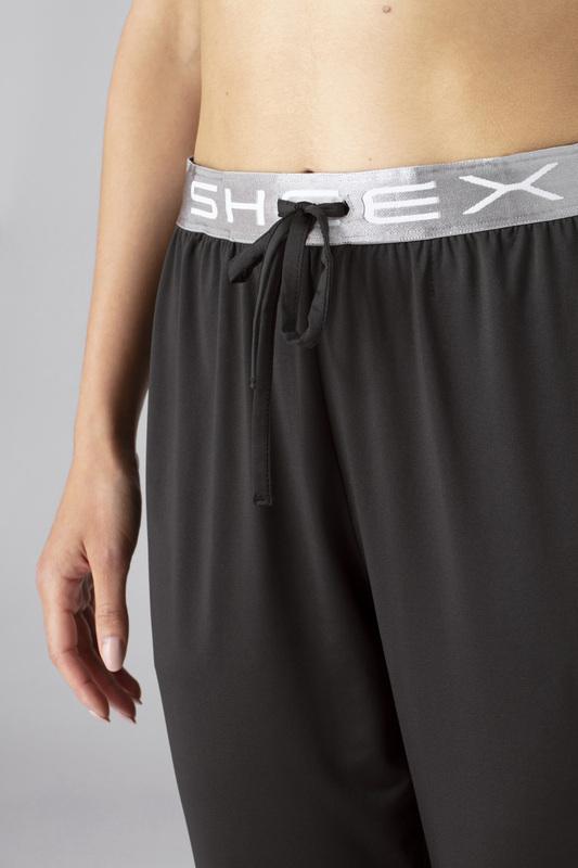 Close up image of model wearing SHEEX Women's Modern Jogger in black #choose-your-color_black