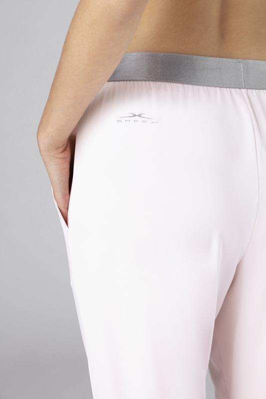 Close up detail image of SHEEX Women's Modern Jogger on model shown blush-pink #choose-your-color_blush-pink